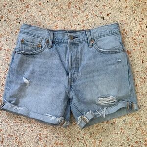 Light blue, high-rise, ripped Levi's Jean shorts